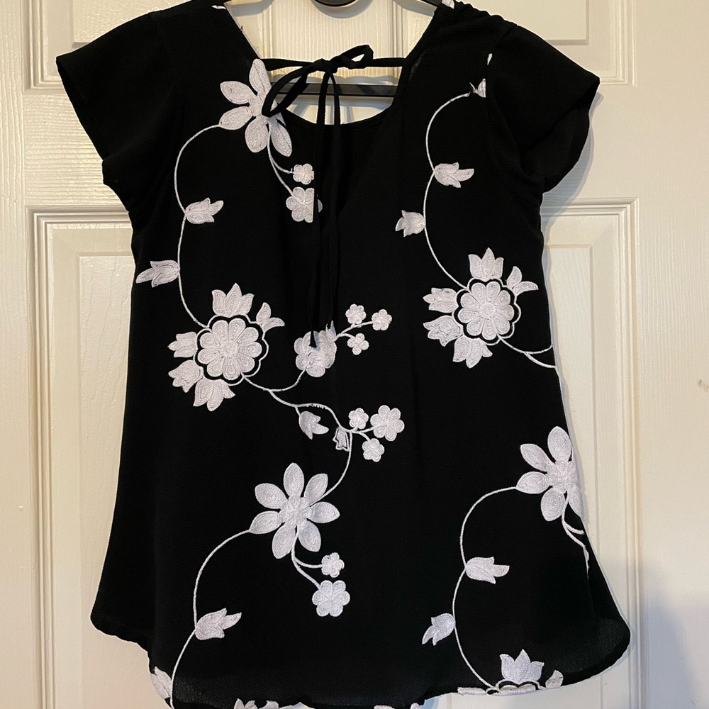 Beautiful Black top with white embroidery flowers.